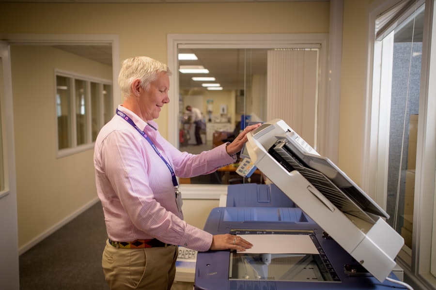 A technician servicing an office printer